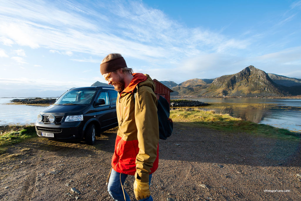 Hiker and a VW T5 California i Lofoten Islands